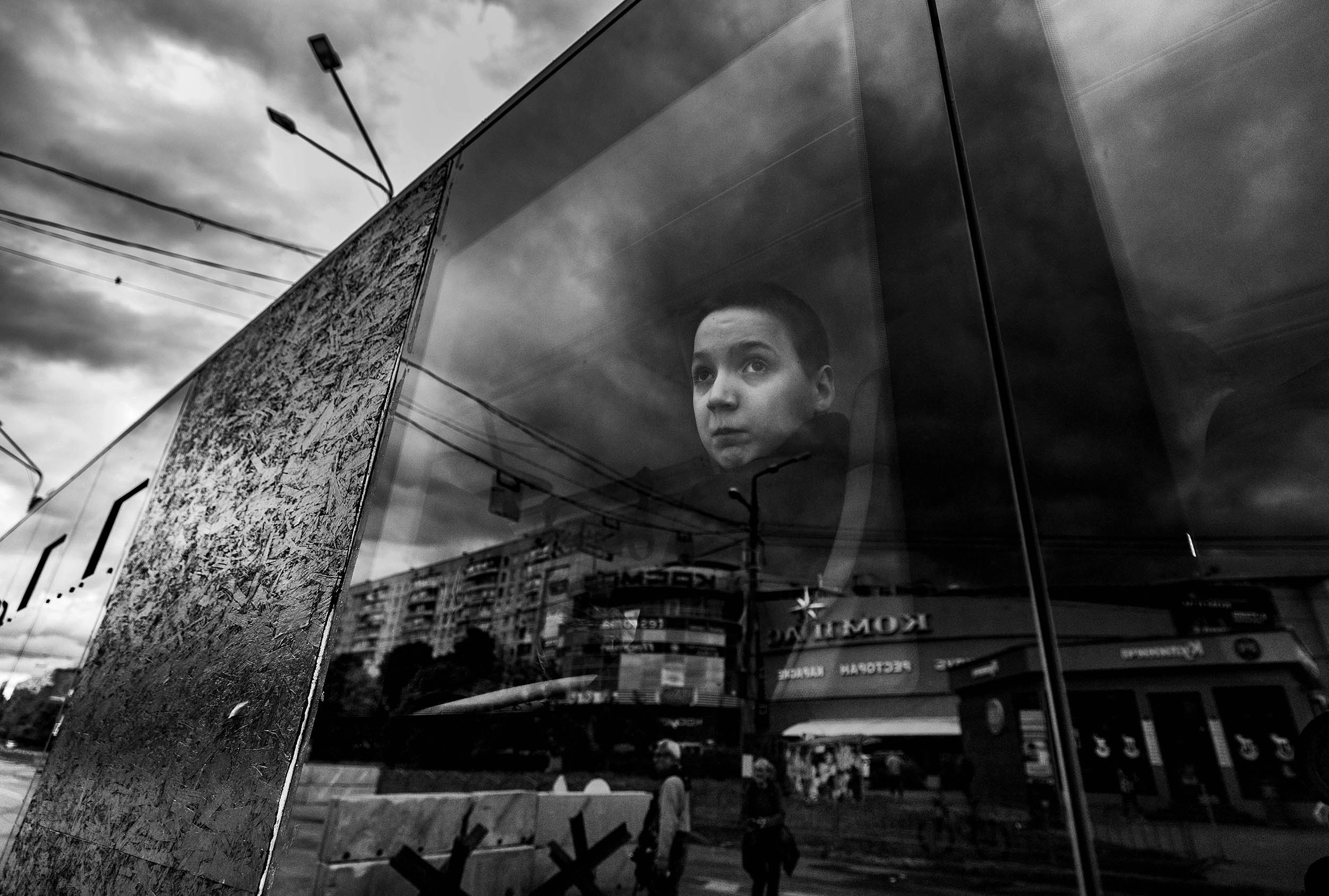 A young boy looks out the bus window after leaving the Kharkiv metro station on May 22, 2022, after seeking shelter there for three months following Russians invasion of Ukraine of Ukraine on February 24, 2022.